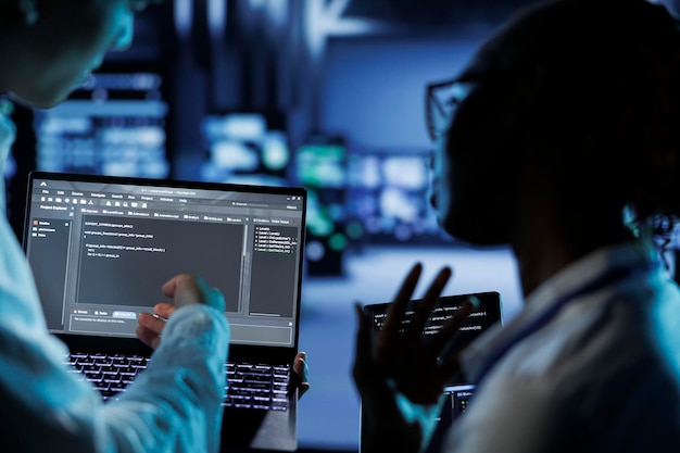 Data center professionals code on tablet