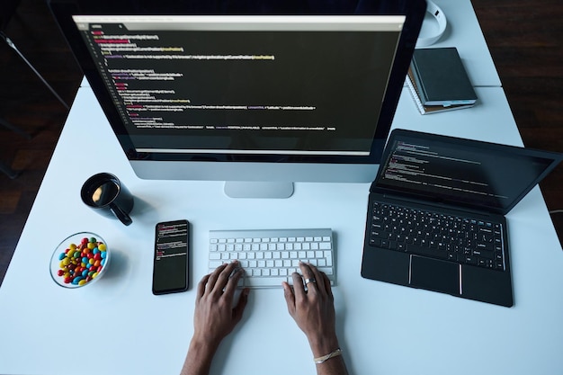 Developer working on computer at his workplace