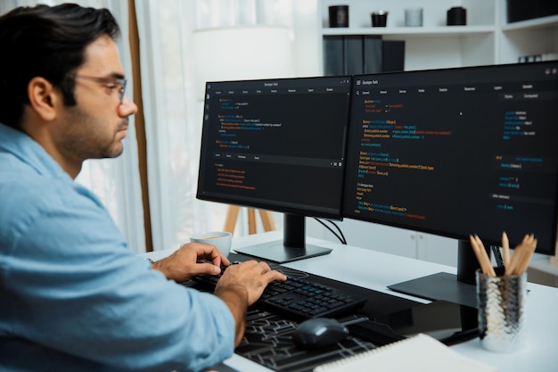 Developer working software development coding two computer code screen surmise