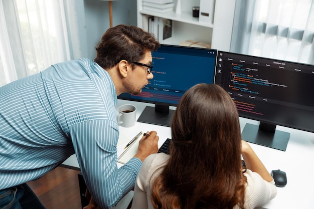 Developers program coding discussing website planning software Postulate