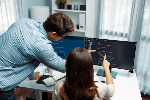 Developers program coding discussing website planning software postulate