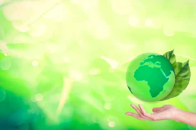 Digital composite image of hand holding globe