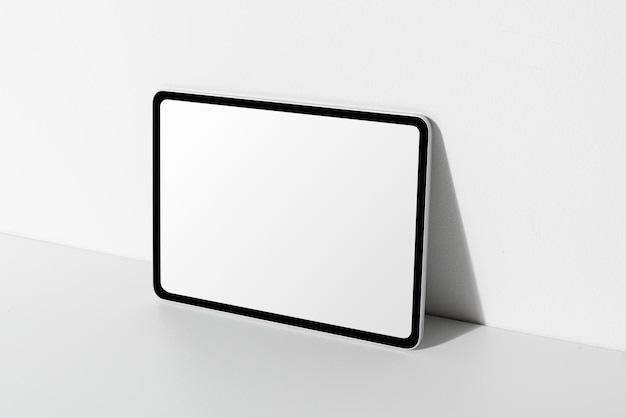 Digital tablet png screen mockup by the wall