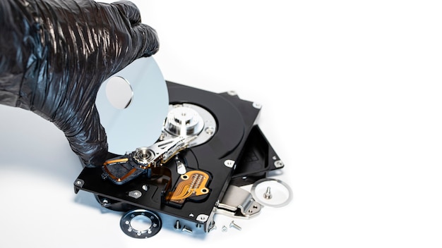 Disassembled hard drive from the computer, hdd with mirror effect. Opened hard drive from the computer hdd with mirror effects. Part of computer pc, laptop