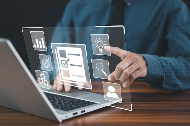 DMS is document management concept Man using a computer to document management in online documentation database and digital file storage system or software records keeping database technology