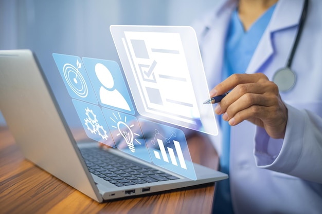 doctor using computer document management system dms online documentation database process automation to efficiently manage files