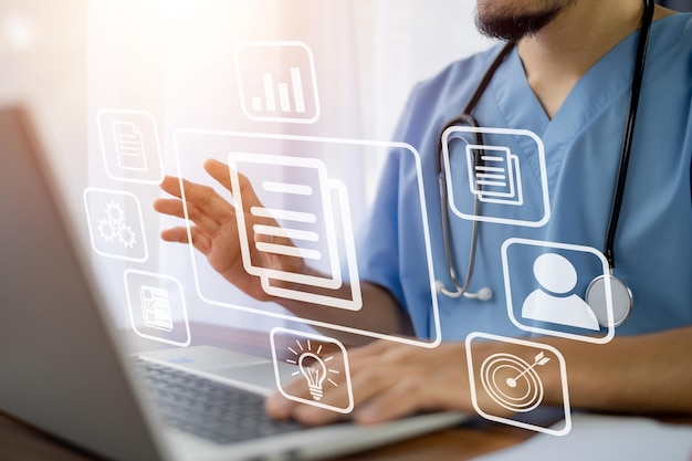 doctor using technology document management on computer system management for cardiologist specialist in treating heart disease for treatment in hospital dms document management concept