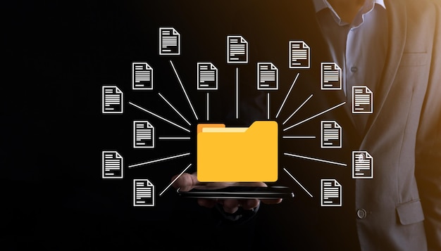 document management system dms .businessman hold folder and document icon.software for archiving, searching and managing corporate files and information.internet technology concept.digital security.