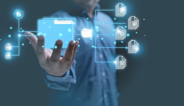 DOCUMENT MANAGEMENT SYSTEM Technology digital internet online keep documents business for security Businessman holding digital folder and document icon corporate files and information on hands