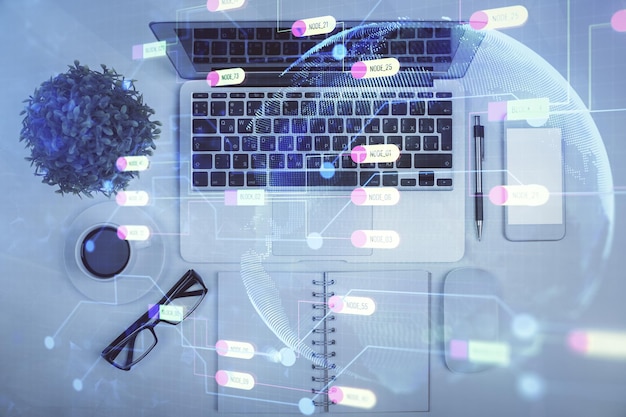 double exposure of data drawing hologram over topview of study desk background with computer concept of ai