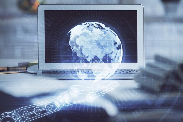 Double exposure of desktop with computer and world map hologram International data network concept