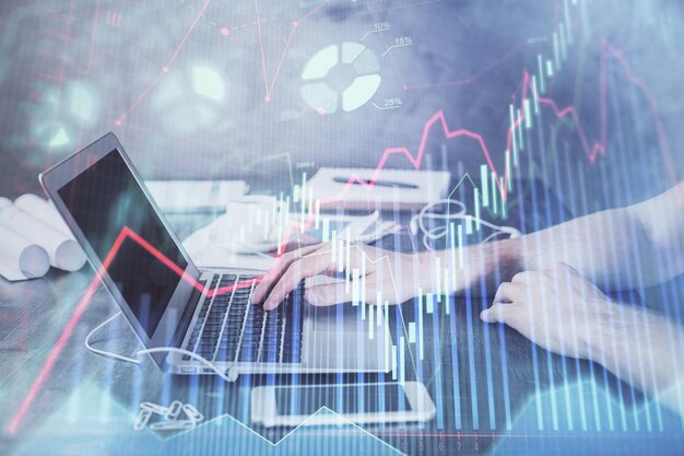 Double exposure of forex chart with man working on computer on background Concept of market analysis