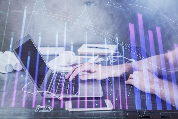 Double exposure of forex chart with man working on computer on background Concept of market analysis