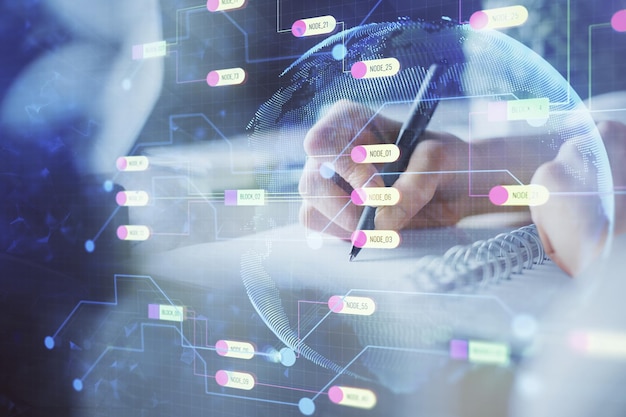 Double exposure of hands making notes background with technology and digital coding huds Data learning concept