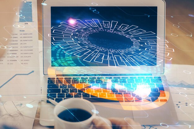 Double exposure of laptop computer and technology theme hologram Concept of freelance work
