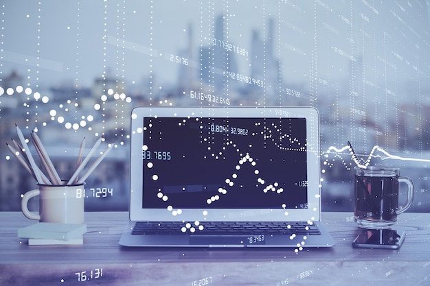 Double exposure of laptop computer and technology theme hologram Concept of freelance work