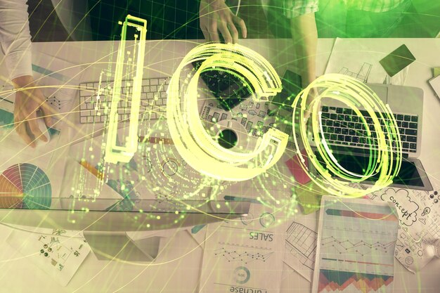 Double exposure of man and woman working together and crypto finance theme hologram Blockchain business concept Computer background