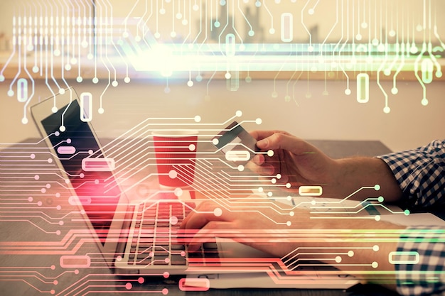Double exposure of man hands holding a credit card and data theme drawing Ecommerce and technology concept