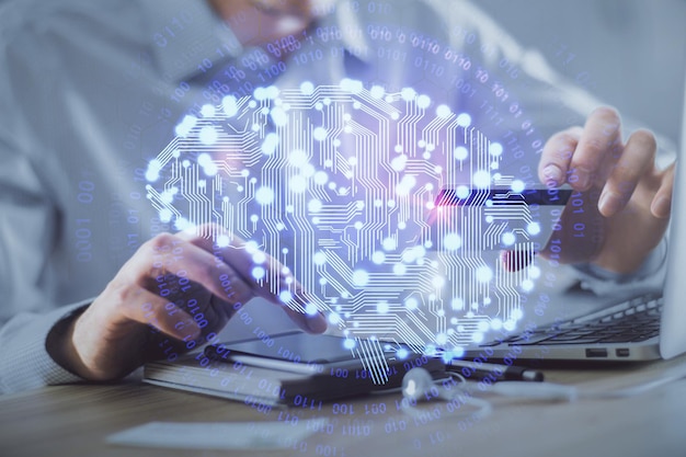 Double exposure of man hands typing on computer with credit card and brain theme drawing Ecommerce and AI concept