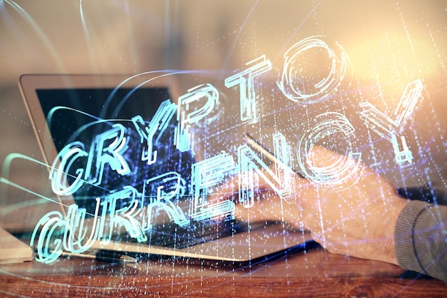 Double exposure of man's hands holding and using a phone and crypto currency blockchain theme drawing