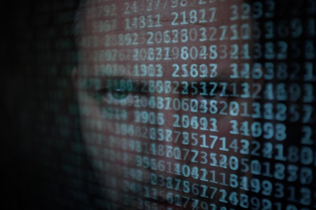 Double exposure of man with binary codes