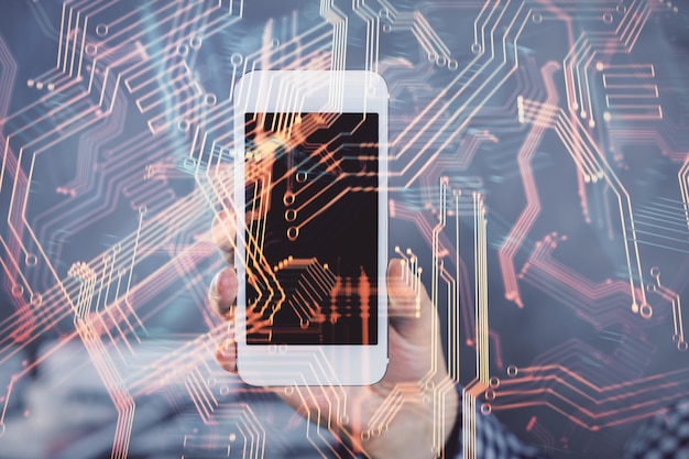 double exposure of mans hands holding and using a digital device and tech theme hologram drawing technology concept