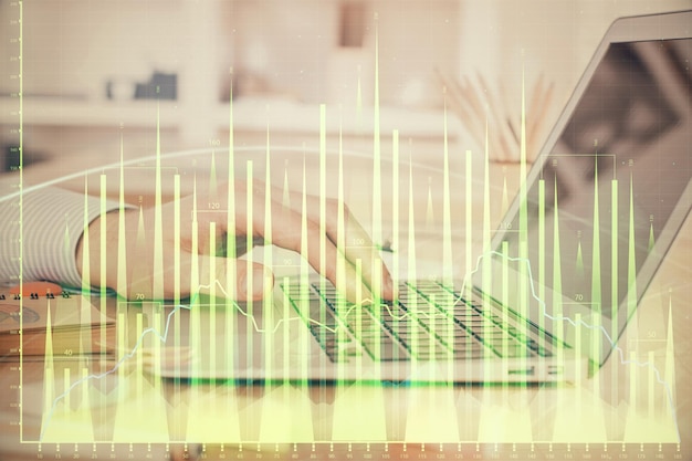 Double exposure of stock market graph with man working on laptop on background Concept of financial analysis