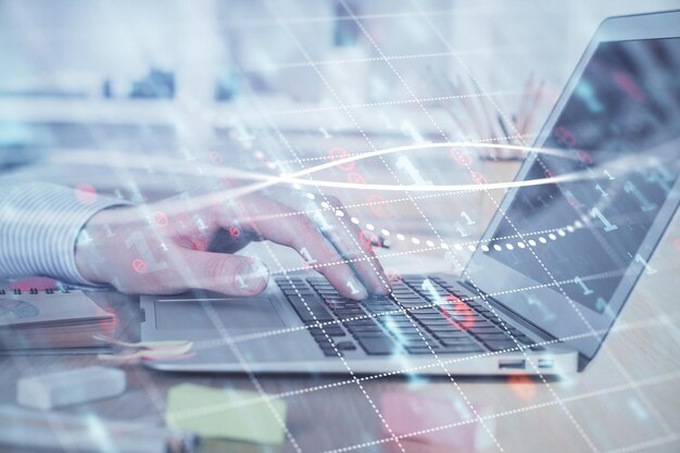 Double exposure of stock market graph with man working on laptop on background Concept of financial analysis