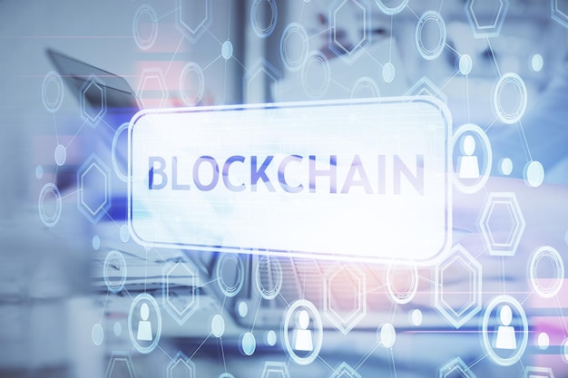 Double exposure of woman hands typing on computer and crypto market theme hologram drawing Blockchain concept