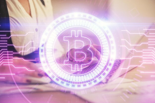 Double exposure of woman hands typing on computer and crypto market theme hologram drawing Blockchain concept