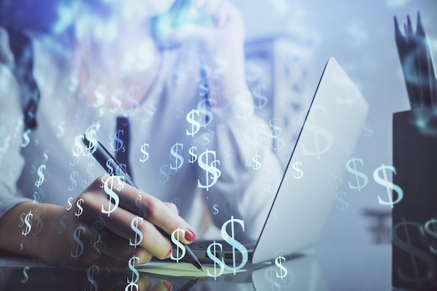 Double exposure of woman hands typing on computer and financial graph hologram drawing Stock market analysis concept