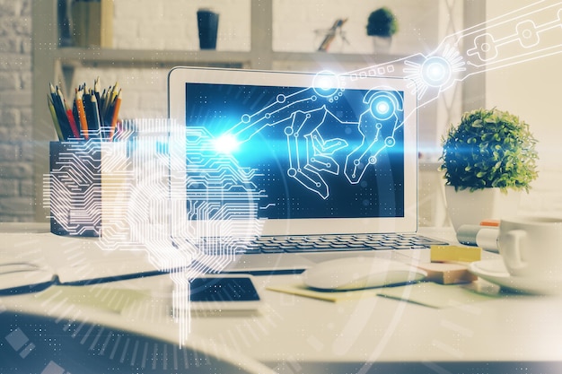 Double exposure of work space with computer and human brain drawing hologram Brainstorm concept