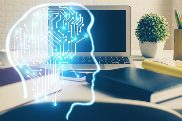 Double exposure of work space with computer and human brain drawing hologram Brainstorm concept