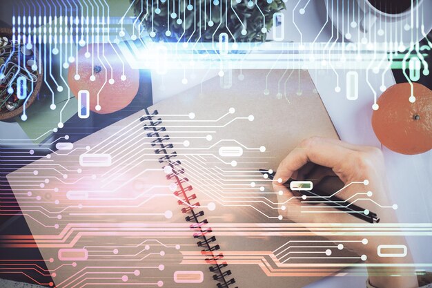 double exposure of writing hand on background with data solution technology hologram ai concept