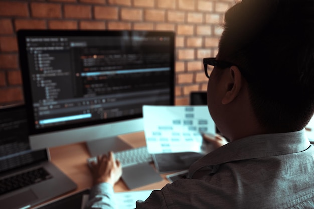 Engineer using computer on desk in office