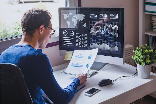 entrepreneur reading financial report on dashboard fintech and audit concept monitoring revenue statement of performance of the company