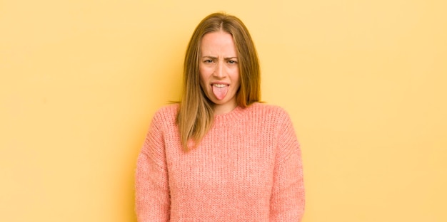 Feeling disgusted and irritated sticking tongue out disliking something nasty and yucky