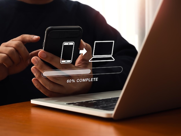 File transfer data migration transmission backup files concept Loading progress bar and smartphone sending to computer icons appear while person using mobile phone to sharing file with 2 devices
