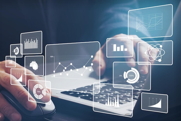 Financial charts showing growing and businessman working on the laptop