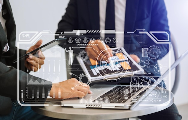 Financial report data of business operations balance sheet and income statement and diagram as Fintech conceptBusiness team meeting digital tablet and computer laptopxA