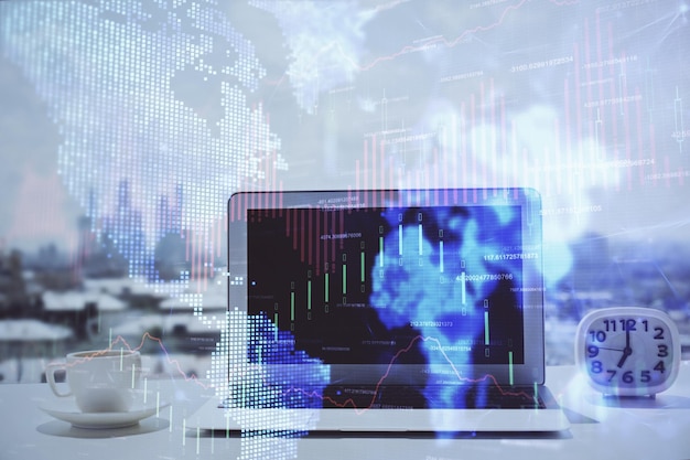 forex chart hologram on table with computer background multi exposure concept of financial markets