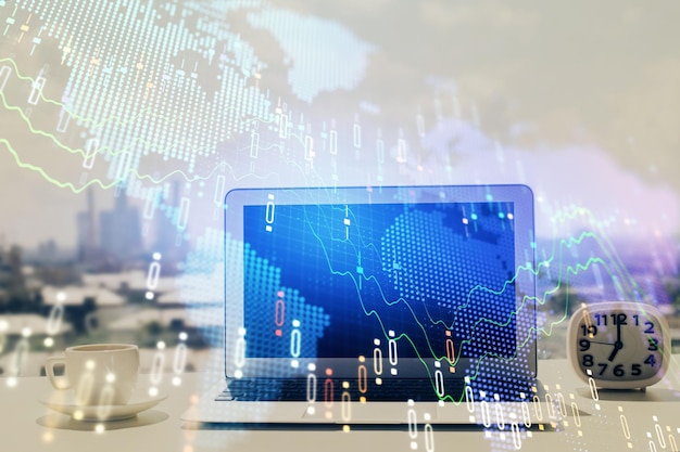 forex graph hologram on table with computer background multi exposure concept of financial markets