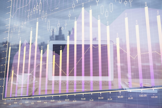 forex graph hologram on table with computer background multi exposure concept of financial markets