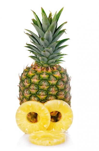 fresh pineapple fruits with cut and green leaves isolated on white