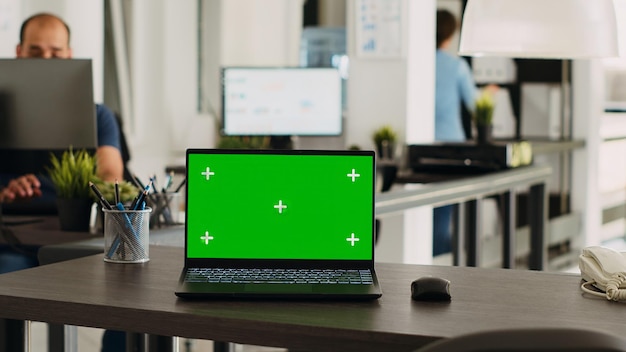 Greenscreen laptop in coworking space