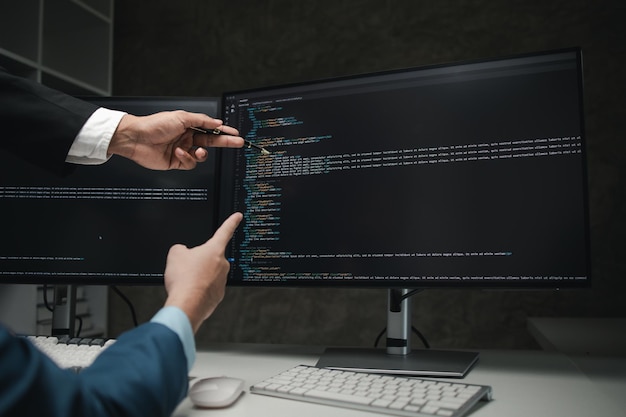 Group of programmers brainstorm together to write programs on the computer designing programs to meet the needs of users and friendly users designing programs to help manage work Programmer concept