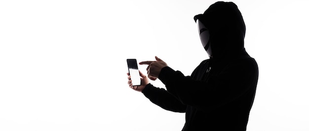 hacker anonymous and face mask with smartphone in hand