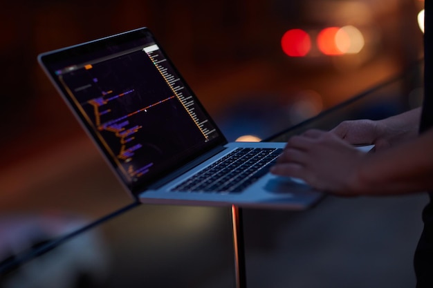 Hacker code and laptop with hands of person for ransomware cyber security and phishing Coding technology and crime with closeup of programmer for fraud network system and data scam at night