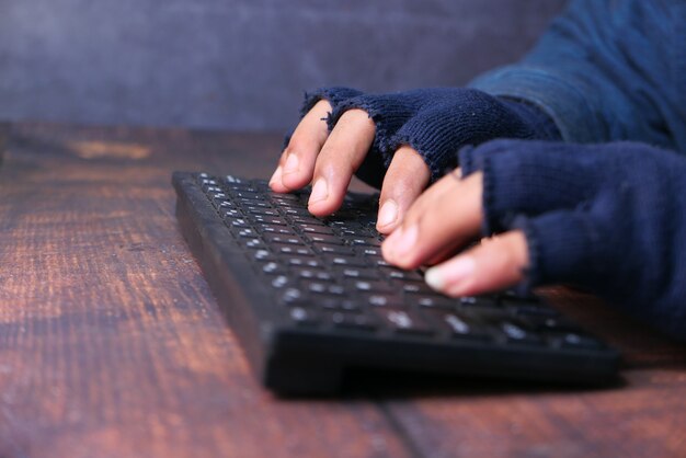 hacker hand stealing personal data, close up