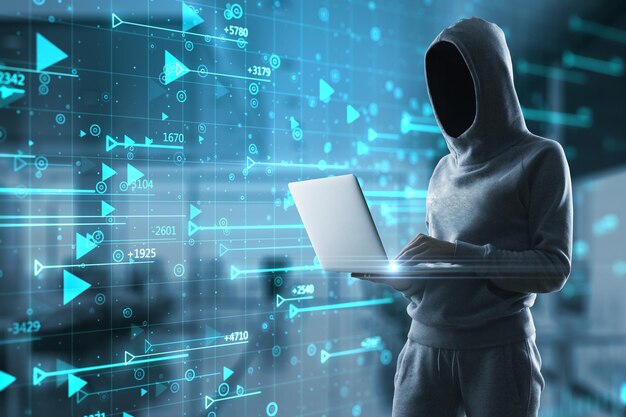 Hacker holding laptop